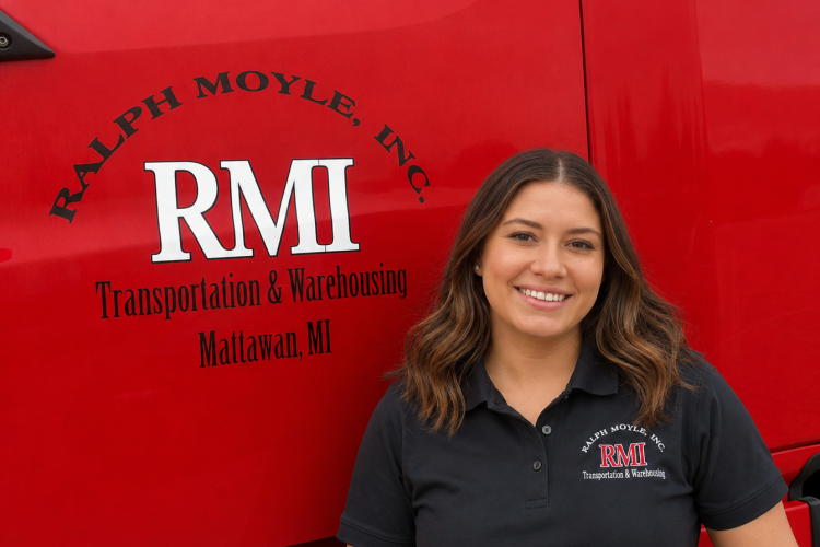 Ralph Moyle apprentice driver standing in front of her assigned truck in Mattawan, Michigan.